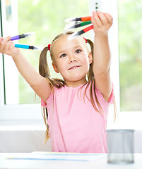 Image showing Cute cheerful child drawing using felt-tip pen