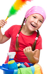 Image showing Young girl is dressed as a cleaning maid