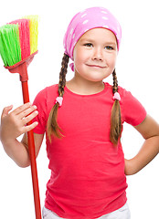 Image showing Young girl is dressed as a cleaning maid