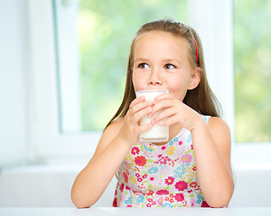 Image showing Little girl with a glass of milk