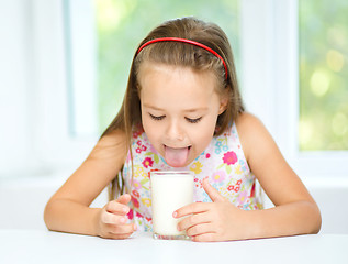 Image showing Little girl with a glass of milk