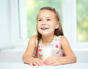 Image showing Cute little girl with a glass of milk