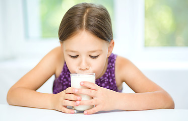 Image showing Little girl with a glass of milk