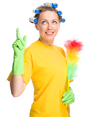Image showing Young woman holding static duster