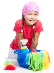 Image showing Young girl is dressed as a cleaning maid