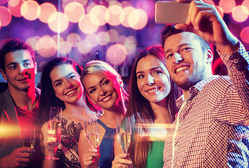 Image showing friends with glasses and smartphone in club