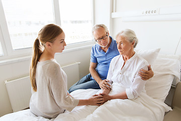 Image showing family visiting ill senior woman at hospital