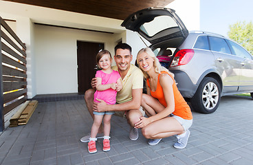 Image showing happy family with hatchback car at home parking