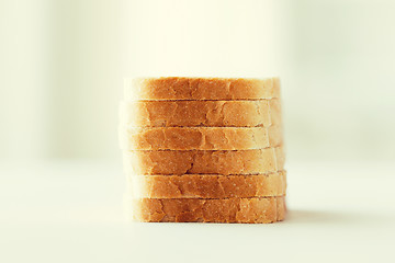Image showing close up of white sliced toast bread pile on table