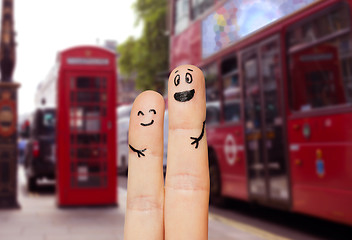 Image showing close up of two fingers with smiley faces