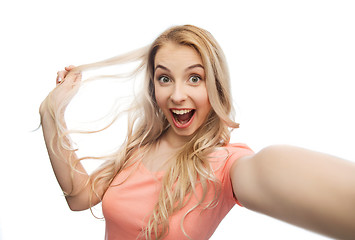 Image showing smiling young woman taking selfie
