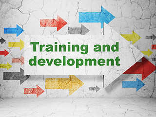 Image showing Education concept: arrow with Training and Development on grunge wall background