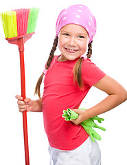 Image showing Young girl is dressed as a cleaning maid