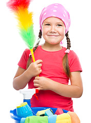 Image showing Young girl is dressed as a cleaning maid