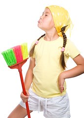 Image showing Young girl is dressed as a cleaning maid