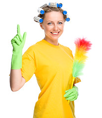 Image showing Young woman holding static duster