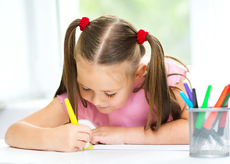 Image showing Cute cheerful child drawing using felt-tip pen