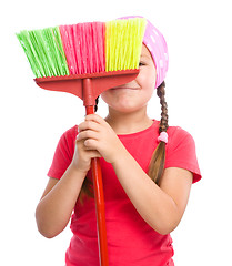 Image showing Young girl is dressed as a cleaning maid