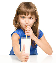 Image showing Cute little girl with a glass of milk