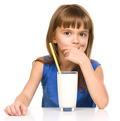 Image showing Cute little girl with a glass of milk