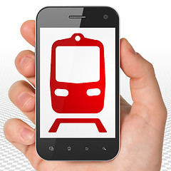 Image showing Tourism concept: Hand Holding Smartphone with Train on display