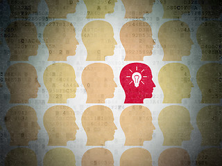 Image showing Finance concept: head with light bulb icon on Digital Data Paper background