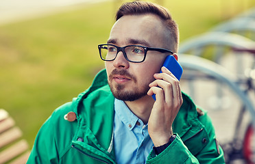 Image showing young hipster man calling on smartphone