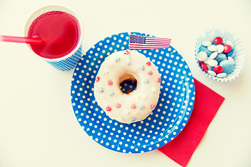 Image showing donut with juice and candies on independence day