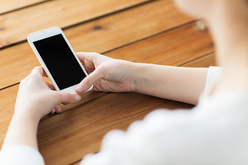 Image showing close up of woman texting on smartphone