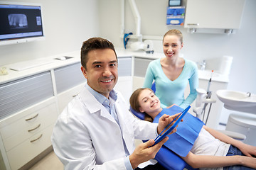 Image showing dentist with tablet pc, patient girl and mother