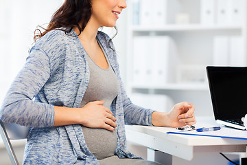 Image showing close up of pregnant woman at medical office