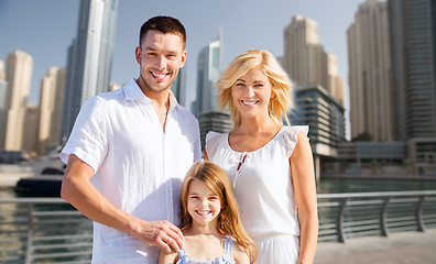 Image showing happy family over dubai city street background