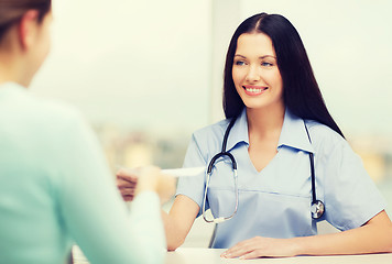 Image showing smiling doctor or nurse with patient