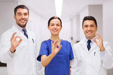 Image showing group of medics at hospital showing ok hand sign