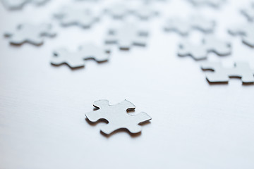 Image showing close up of puzzle pieces on table