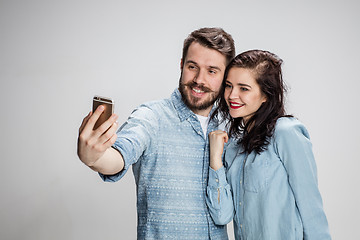 Image showing Portrait of happy couple on gray background