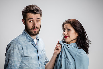 Image showing The young couple with different emotions during conflict