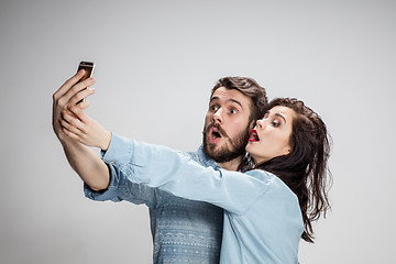 Image showing Portrait of happy couple on gray background