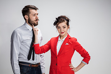 Image showing The business man and woman communicating on a gray background