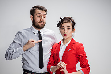 Image showing The business man and woman communicating on a gray background