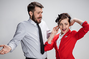 Image showing The business man and woman communicating on a gray background