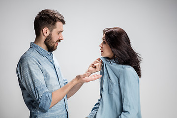 Image showing The young couple with different emotions during conflict