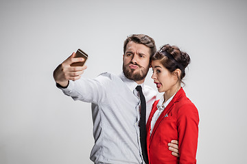 Image showing Two colleagues friends taking selfie with telephone camera