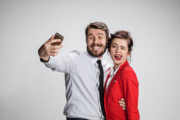 Image showing Two colleagues friends taking selfie with telephone camera