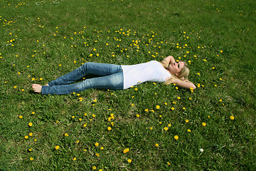 Image showing Woman lying on grass