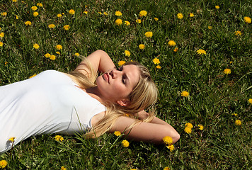 Image showing Woman lying on grass