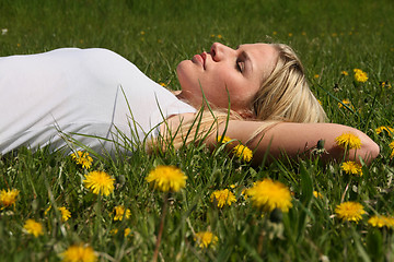 Image showing Woman lying on grass