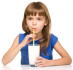 Image showing Cute little girl with a glass of milk