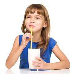 Image showing Cute little girl with a glass of milk