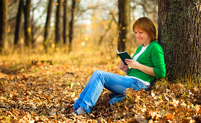 Image showing Portrait of a woman in autumn park